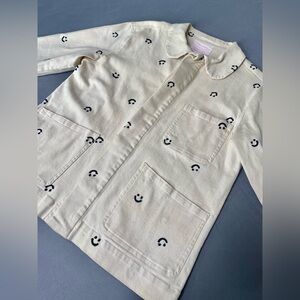 Bando light pink jacket with smiley faces. Size XS fits like a large.